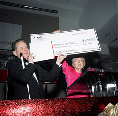 President Maurer and Betty Woodward, president of the NFB of Connecticut, hold up the giant check from the Connecticut affiliate that completed the NFB's five-year capital campaign.