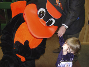 The Orioles mascot, the Bird, leans down to talk to Katrina Beasley of Colorado, who is not quite sure what to think of the attention.