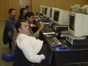 Students listen intently to their trainer explain optical character recognition during one of the eight training sessions.