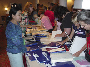 Happy browsers like these made their way down tables, accepting advice from volunteers behind the table.