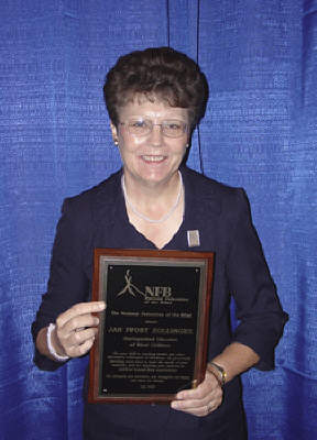 Jan Zollinger poses with her award.