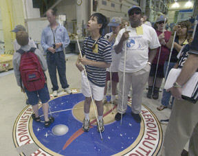 Circle of Life campers tour Goddard Space Flight Center.   Left to right: Bryce Gitzen (back), Andrew Wai, and Paul Howard.