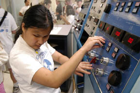 Amy Herstein learns the controls in the launch control room at NASA's Wallops Flight Facility.
