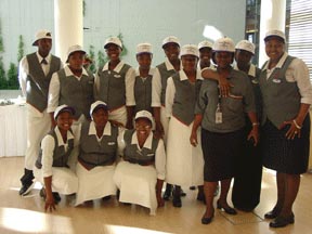 Convention Center employees pose together, wearing their Spungin for treasurer caps.