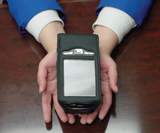A picture of hands holding the Kurzweil�National Federation of the Blind Reader