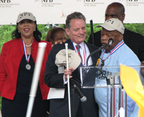 Left to right, Carolyn Young, Marc Maurer, and John Lewis pose for a picture.