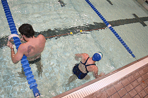 Irish Aquatics aquatics swimmer Ashley Nashleanas works with Fernando Carvalho on the AdaptTap system designed for blind swimmers. (Photo provided by Annie Sawicki)