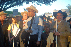Federation leaders assembled at the head of the march line. From left to right are Tommy Craig, Mary Ellen Jernigan, Marc Maurer, Anil Lewis and his son, and Kevan Worley.