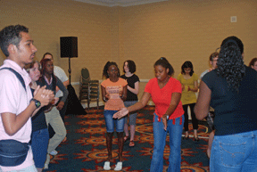 Faith Penn leads the teens in step dancing.