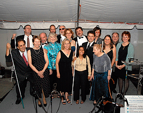 Pictured are some of the Twenty Who Led the Way. Left to right in the back row are Dan Wenzel, Eric Woods, Ray McGeorge, Scott LaBarre, Alice George, and Tom Anderson. Middle row are Jim Barbour, Kevan Worley, Pricilla Hudson, Jennifer Stevens, Mark Riccobono, Julie Deden, and Christine Flory. Front row are Julie Hunter, Duncan Larsen, Buna Dahal, and Diane McGeorge. Not pictured but honored are Marc Maurer, Bill Saker, and Kimberley Johnson.
