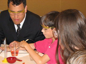 Cary Supalo instructs students in distinguishing the colors of liquids using a sensor.