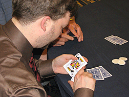 A player examines the hand he has been dealt at Monte Carlo Night. 