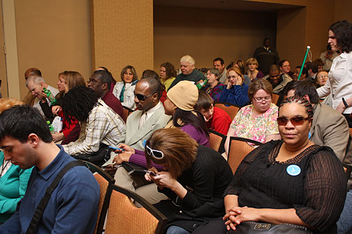 Federationists gathered in the Columbia Ballroom of the Holiday Inn Capitol on Monday evening, February 1, to be present for the great gathering-in meeting. Members are seen here sitting, chatting, and waiting for the event to begin. The room was full to capacity. Many Federationists took refuge in our overflow room&nbsp;so that they could sit during the two-hour session.