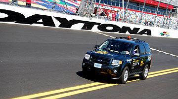 Mark Riccobono drives the NFB�s blind-drivable car around the track at the Daytona Speedway.