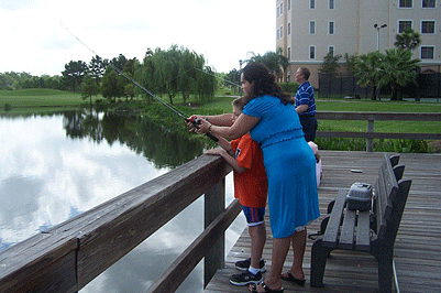 A blind child learns about the sport of fishing.