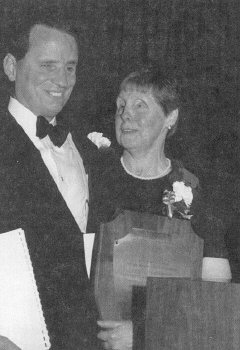 Betty Niceley hold Jacobus tenBroek Award plaque while President Maurer look on.