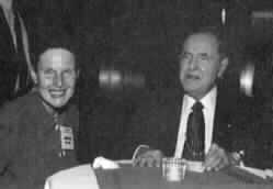 Jamie Hilton and Kenneth Jernigan sit chatting at a tableduring the NCSAB reception.