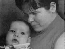 Photo description: This is a close-up shot of the faces of a mother and baby.