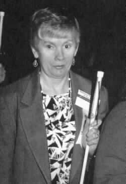 Photo of Sharon Maneki with her white cane