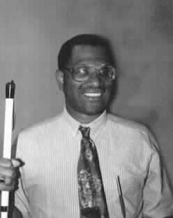 The Rev. Robert Parrish holding his cane.