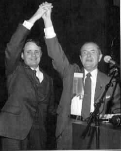 Dr. Jernigan and Marc Maurer with linked hands raised.