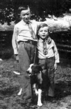 Photo of two boys with their dog
