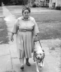 Photo of Gigi Firth with
her dog.