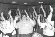 Photo of people dancing at family hospitality.