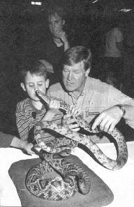 Photo of Kirt Manwaring holding a snake.
