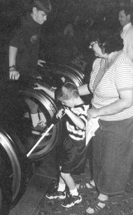 Diane Foster and her son Peter from Kentucky are pictured
working on escalators during cane travel workshop. 