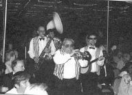 Photo of the Dixieland band marching in playing 