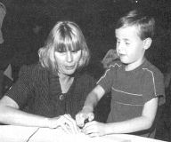 Joy Harris is shown demonstrating the proper use of the slate and stylus to 
Kirt Manwaring of Utah.