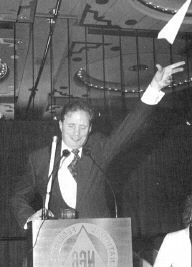 President Maurer pictured throwing a paper airplane.