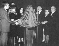 Pictured are six people prepared to unveil the bronze bust of Dr. jernigan