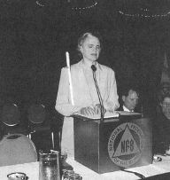 Photo of Barbara Pierce speaking at the memorial service.