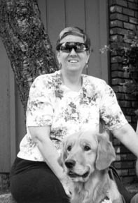 Photo of Toni Eames and her guide dog Ivy.