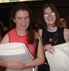Kerri Regan and Megan Kelly of New York are delighted with their selections at the Braille book flea market event.