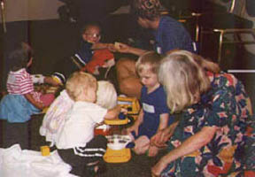 These children, both blind and sighted, play in an age-appropriate manner in this child-care setting.