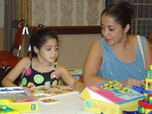 Elora Garcia of New York enjoys playing games with her mom, Maria. Maria Garcia is the president of the New York Parents of Blind Children.