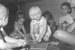 Catherine Jacobsen (center) fits  right in with her sighted preschool  peers in this day care setting.