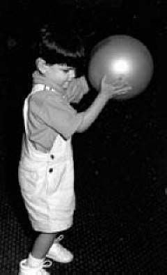 Boy playing with a ball.