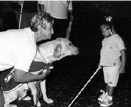 Two-and-a-half year-old Mikaella of Massachusettes has many adventures with her new cane at the 2000 convention.