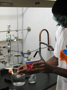 Youth Slam participants experienced new levels of independence and education. The participant above is lighting a Bunsen burner for his experiment.