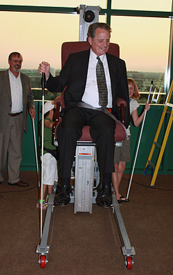Dr. Marc Maurer rises in the air as young blind students apply the scientific principles of simple machines.