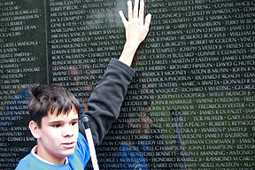 Stephen Toth examines the Vietnam War Memorial.