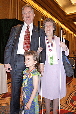 Dr. and Mrs. Maurer enjoy meeting Julia Gebert in a hotel hallway