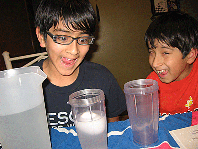 The egg floats! Nick stares in amazement as Alex laughs.