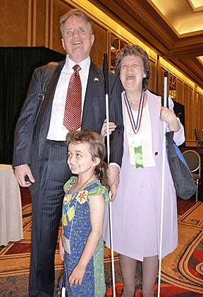 Julia Gebert shares a laugh with Dr. and Mrs. Maurer at an NFB national convention.