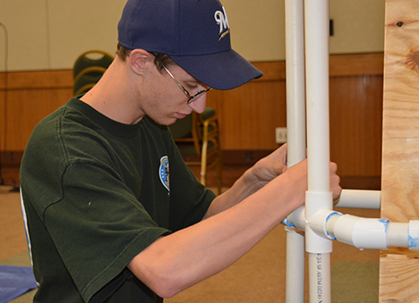 Chris Matthews works on building a structure during STEM EQ