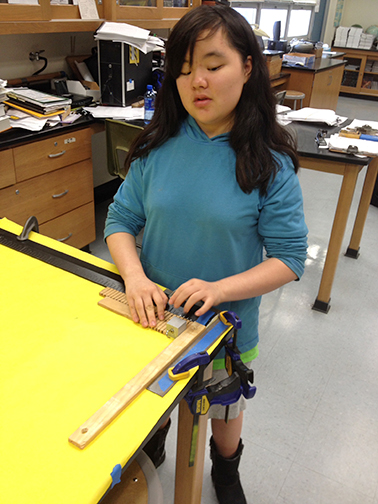 Cricket Bidleman learns to use a Vernier scale in her physics class.